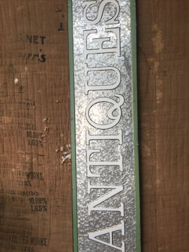 “Antiques” sign